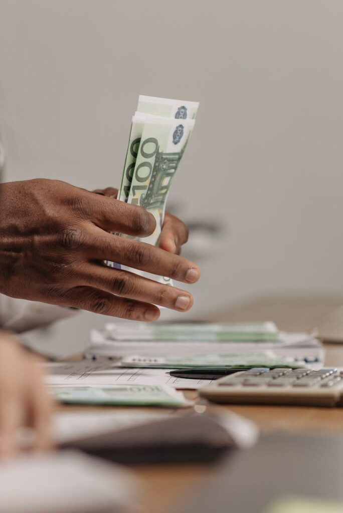 close up shot of a person counting money